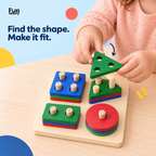 Child fitting a triangle onto a wooden shape sorter board
