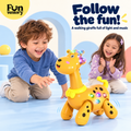 Two toddlers chasing a musical walking giraffe toy