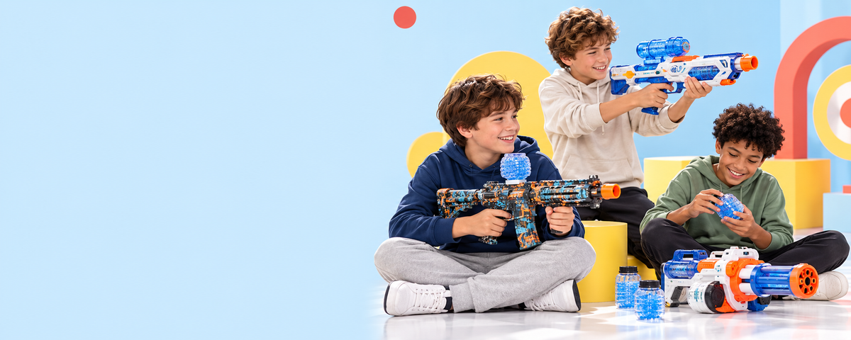 Three kids with colourful water-bead blasters